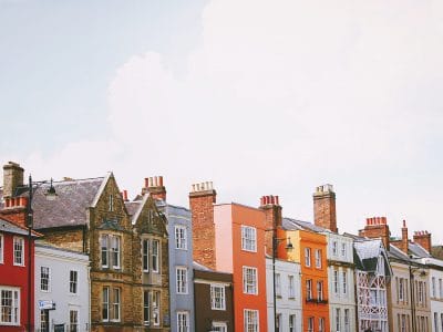 assorted color concrete houses under white clouds during daytime stockpack unsplash scaled